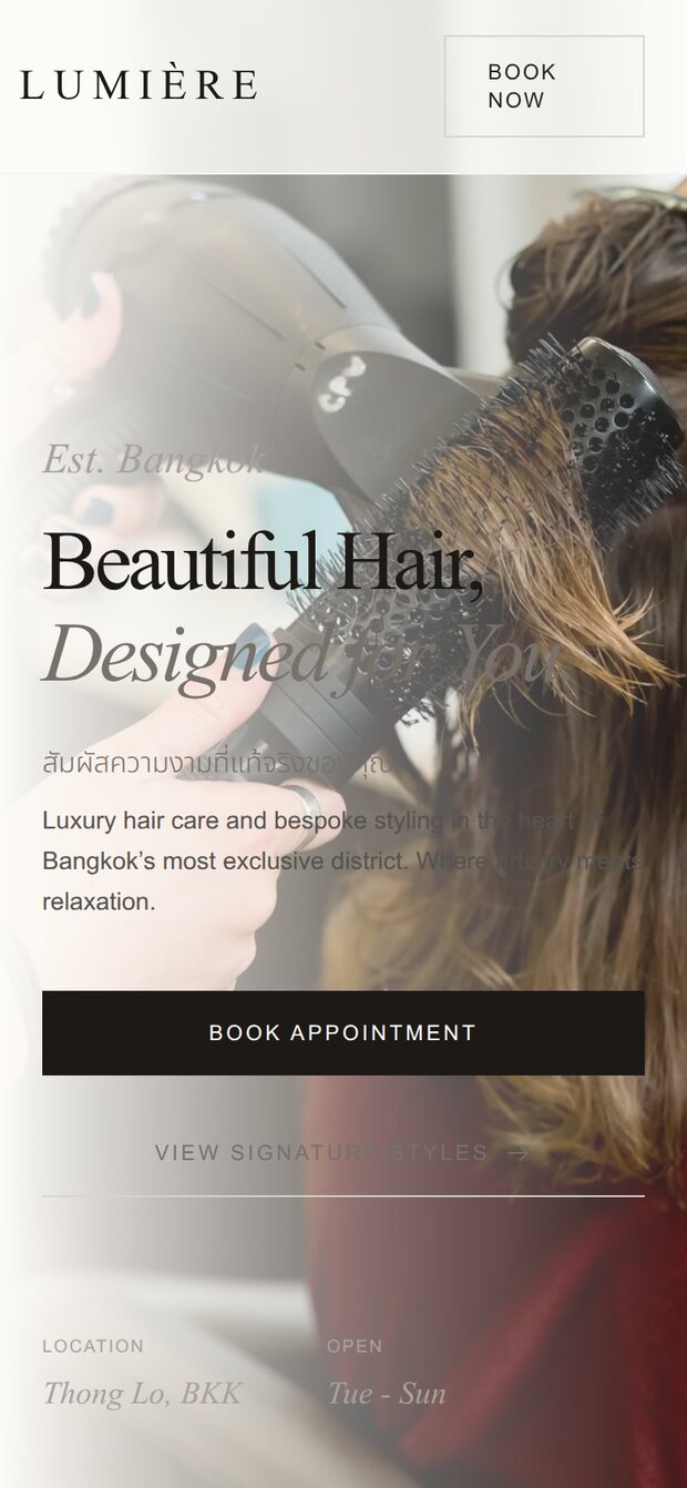 A BkkBoost salon website on a phone